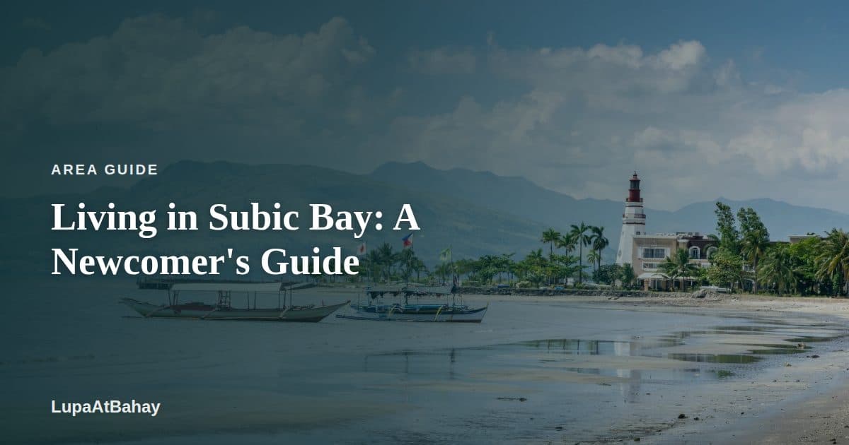 Outrigger boats on the shore of Subic, with a lighthouse, palm trees and mountains behind, under the headline “Living in Subic Bay: A Newcomer's Guide”.